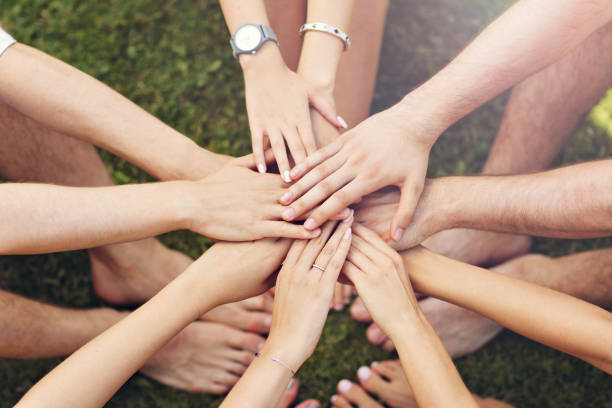 istock Group of friends bonding hands together 824907286