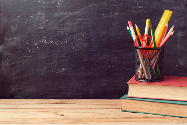 istock Back to school background with books and pencils over chalkboard 824907398