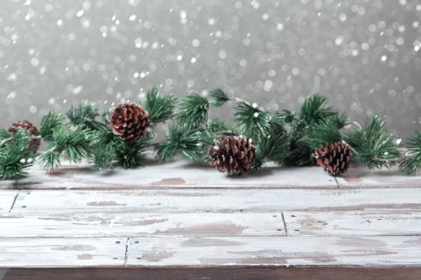 istock Christmas holiday background with empty wooden white table and christmas lights 824907570