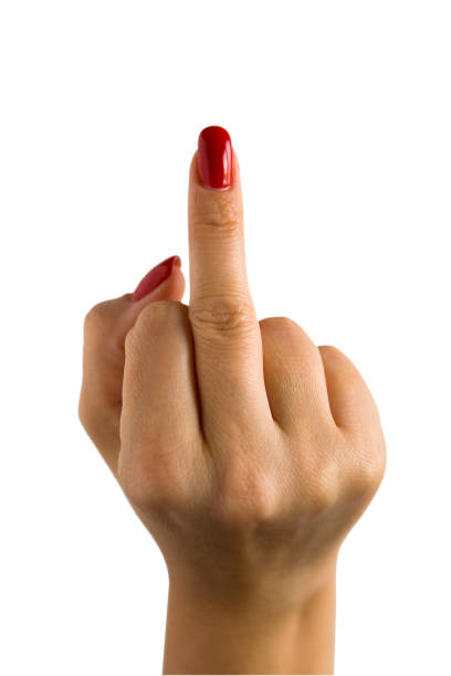 A female hand with red nails shows the middle finger. Obscene gesture.