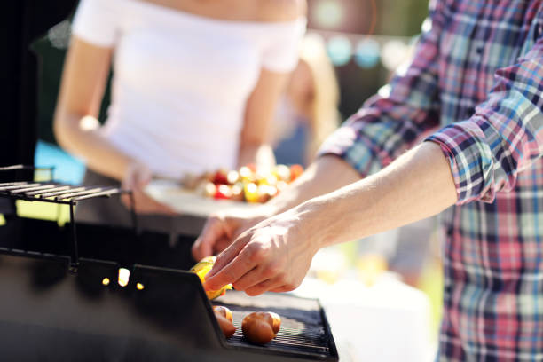istock Friends having barbecue party in backyard 824914466
