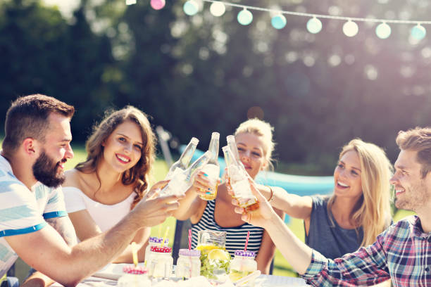istock Friends having barbecue party in backyard 824917510