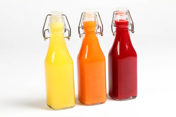 istock Fruit Juice in glass bottles 824923816