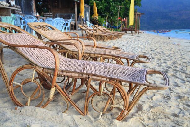 istock Brown wicker beds for relax on costline white sand at Koh Lipe 824924332
