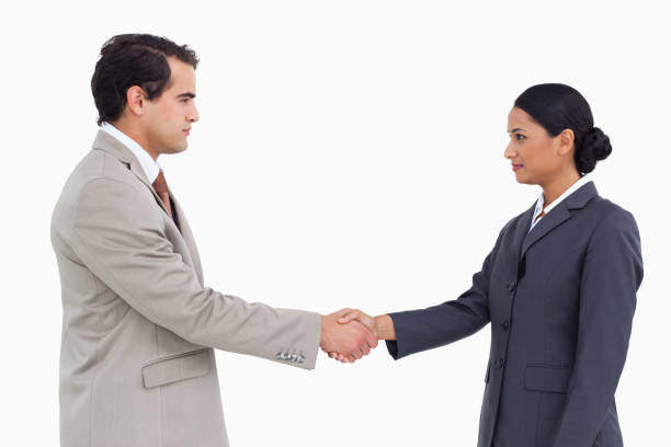 istock Side view of serious business partners shaking hands 824924644