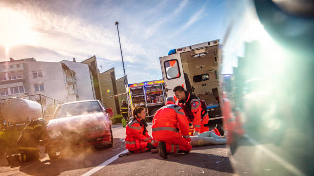 istock Paramedics helping injured woman 824935292