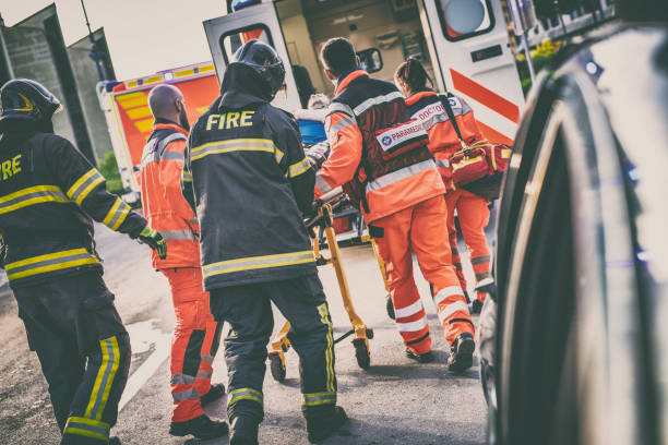 istock Paramedic team helping injured person 824938494