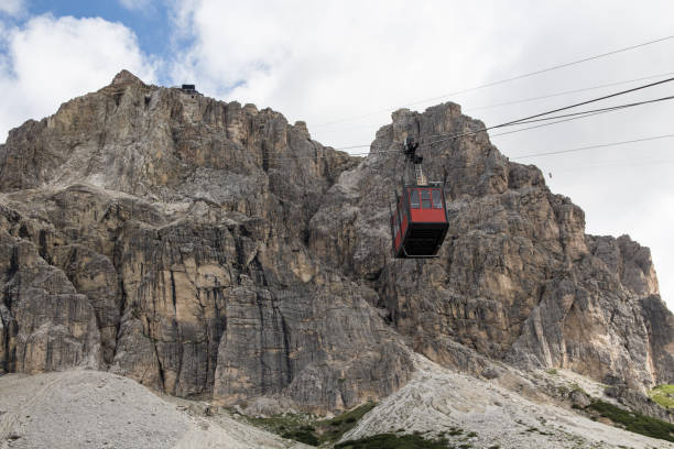 istock Cable car passenger cabin coming down from the mountain peak 824941244