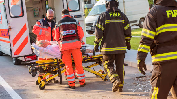 istock Paramedic team helping injured woman 824941382