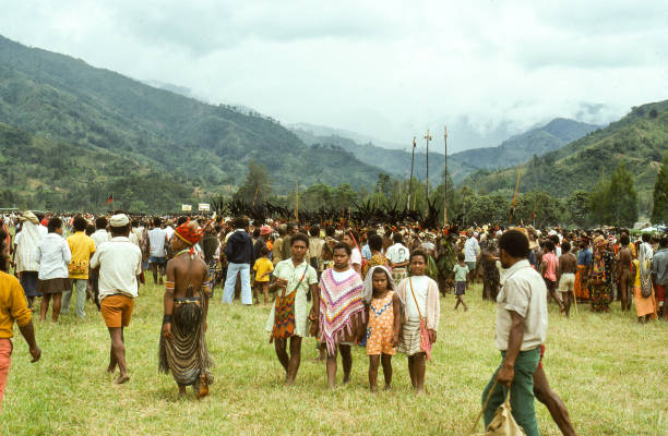 Sing-Sing in Kuchiano, Papua New Guinea. Traditionally dressed people. This Sing-Sing where hundreds of people from surroundings area gather is held every 7th year. Decorations with feathers from paradise birds, face paint and animal skins.