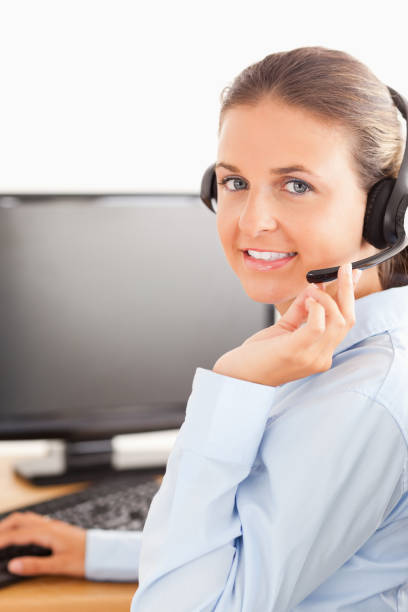 istock Close up of an office worker with a headset 824946274