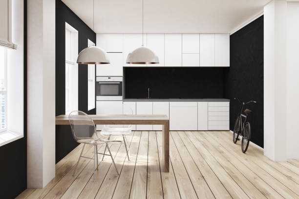 istock White and black kitchen, wooden floor 824949654