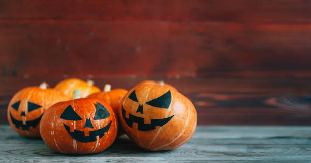 istock Halloween Pumpkins On Wood 824949730