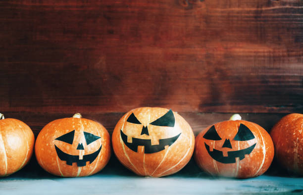 istock Halloween Pumpkins On Wood 824949768