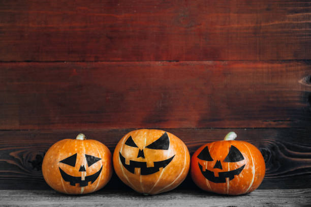 istock Halloween Pumpkins On Wood 824949780