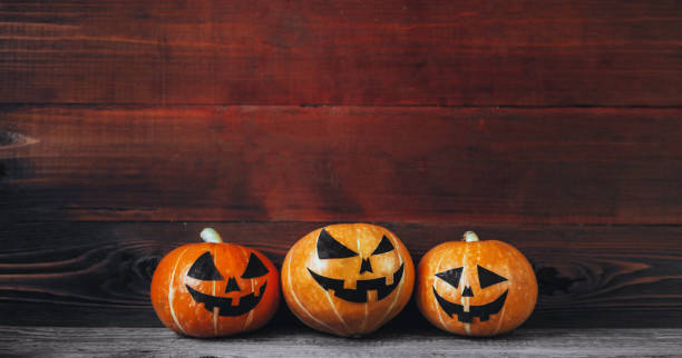 istock Halloween Pumpkins On Wood 824949790