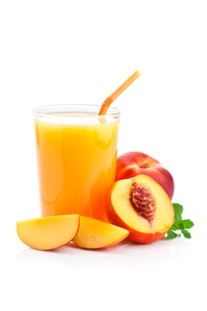 peach juice glass isolated on white background - peach juice imagens e fotografias de stock