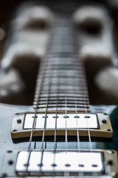istock Electric guitar pickups and neck close up view 824960044