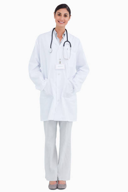 istock Smiling female doctor with hands in her pockets 824970544