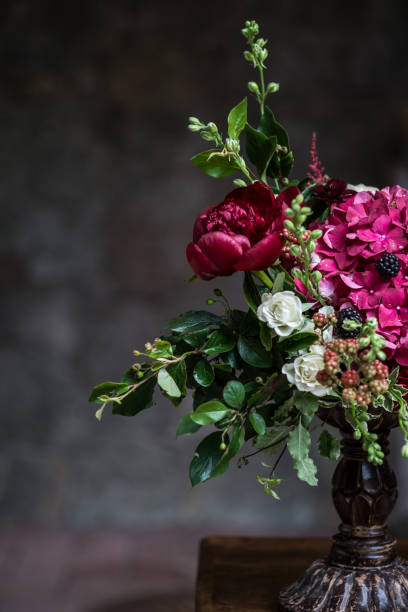 istock Wedding peony bouquet against vintage dark stone background. Rustic style. 824971060