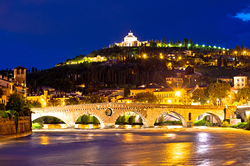 Madonna di Lourdes sanctuary and Adige river in Verona evening view, Veneto region of Italy