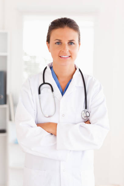 istock good looking doctor looking into the camera 824978022