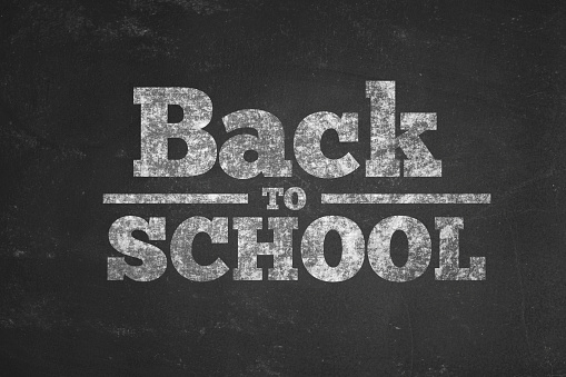 A stock photo of a Chalk Board texture with the words Back to School