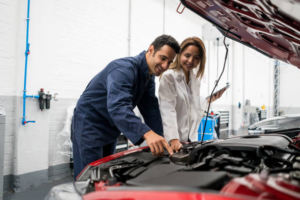 istock Mechanics fixing a car at a garage 824981462