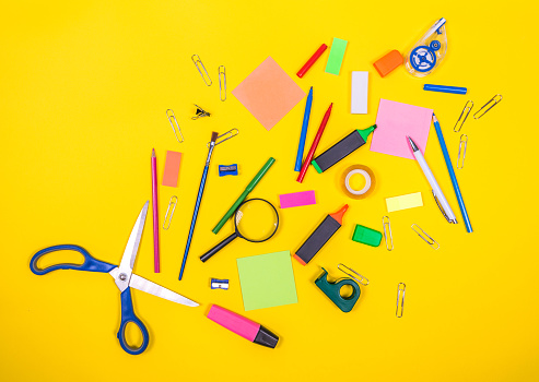 Office stationary or school objects on intensive color background