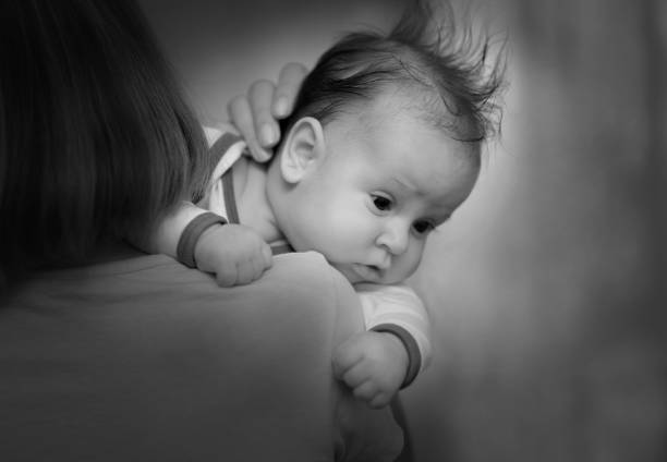 istock Young mother with newborn baby son. 824989414