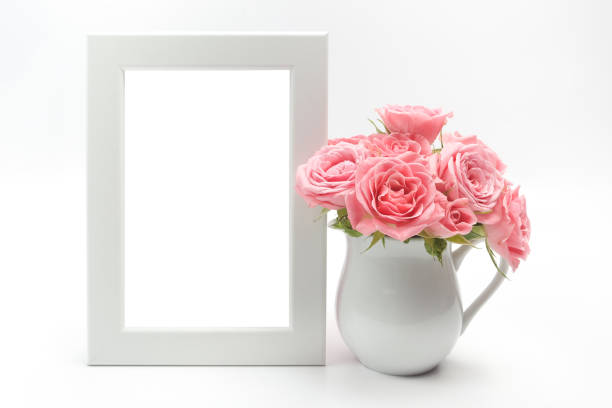 istock Home decoration, picture frame and cup with roses 824990968