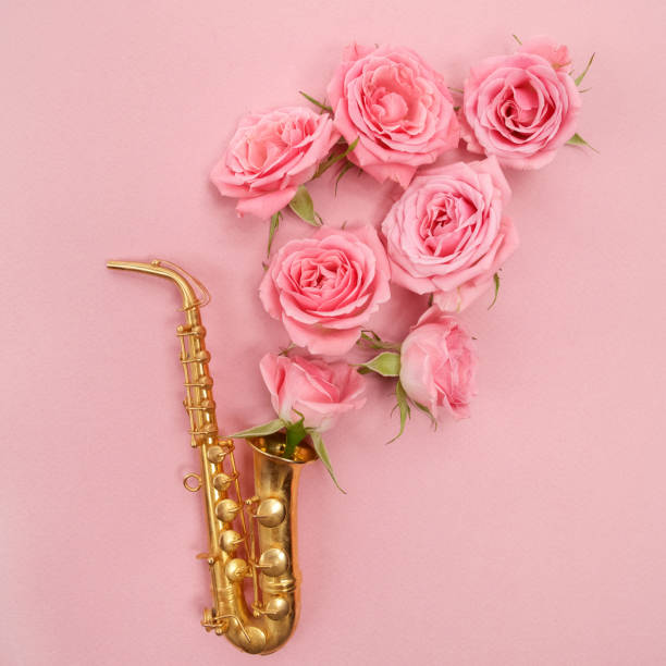 istock Jazz Day. Saxophone with flowers. Flat lay, top view 824992934