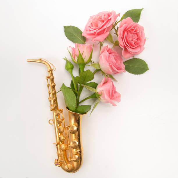 istock Jazz Day. Saxophone with flowers. Flat lay, top view 824994512