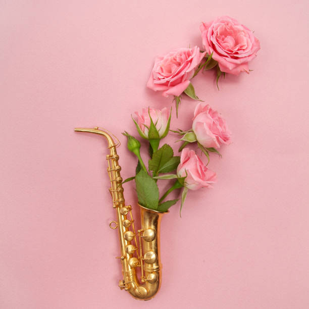 istock Jazz Day. Saxophone with flowers. Flat lay, top view 824994528