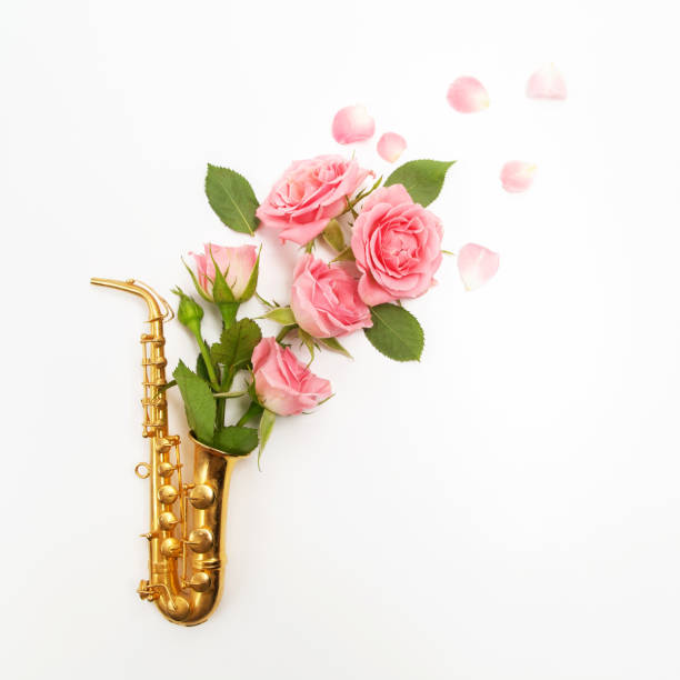 istock Jazz Day. Saxophone with flowers. Flat lay, top view 824994530