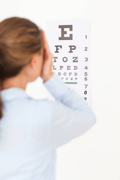 istock Woman looking at an eye test 824994914
