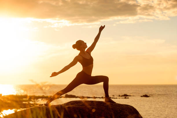 caucasian fitness woman practicing yoga - spiritual practices imagens e fotografias de stock