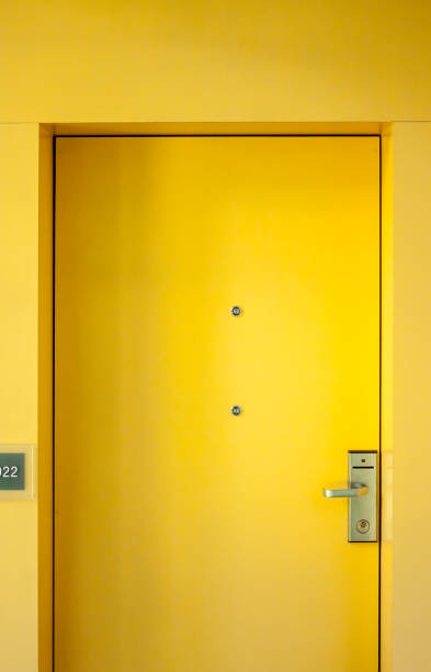 istock yellow hotel door 825008956
