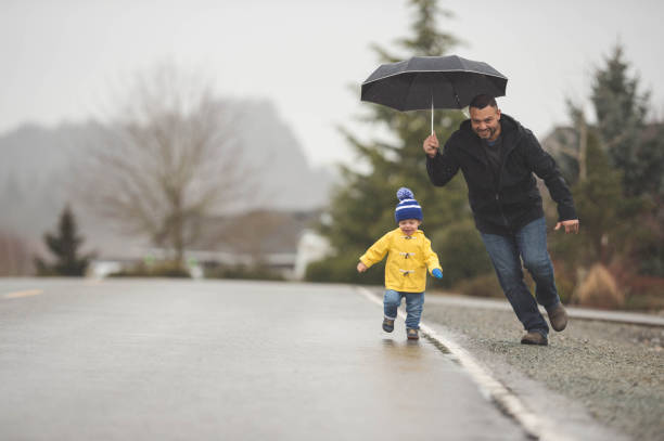 istock Family Walk in the Rain 825011872