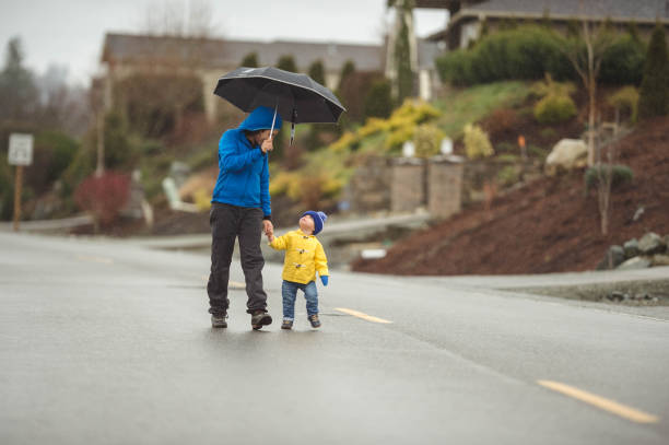 istock Family Walk in the Rain 825011876