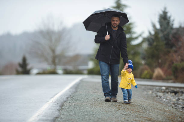 istock Family Walk in the Rain 825011882