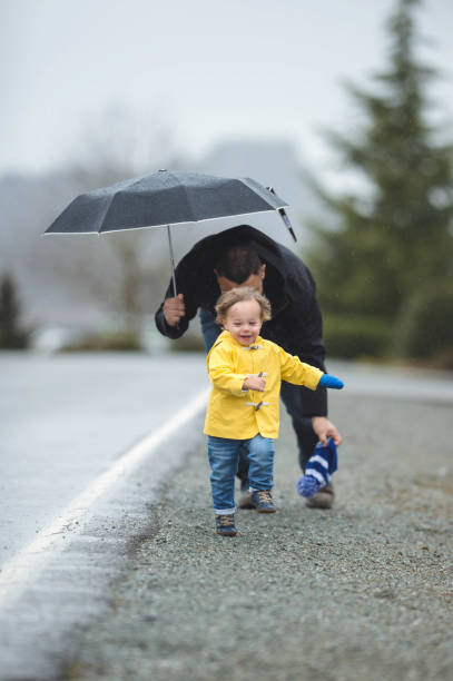 istock Family Walk in the Rain 825011894