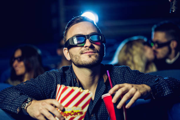 istock Young man watching movies 825013294