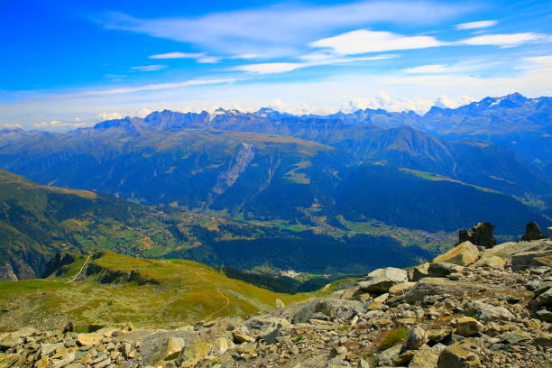 fairy tale landscape from bettmerhorn summit: above idyllic alpine valley and meadows, dramatic swiss snowcapped alps, idyllic countryside, bernese oberland,swiss alps, switzerland - bettmerhorn imagens e fotografias de stock