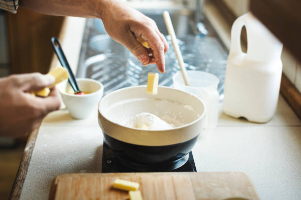 istock Man Mixing Butter Milk Pastry Bakery Concept 825023754