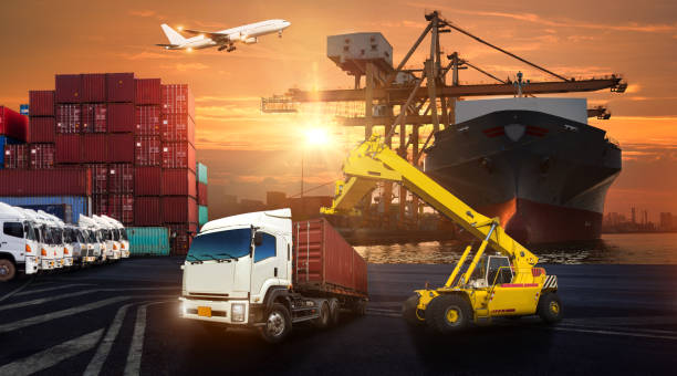 istock forklift handling container box loading to truck in import export logistic, Business logistics concept 825027398