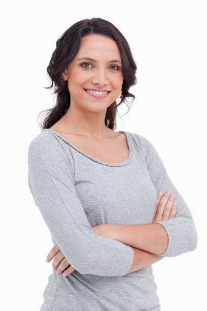istock Smiling young woman with her arms folded 825034480