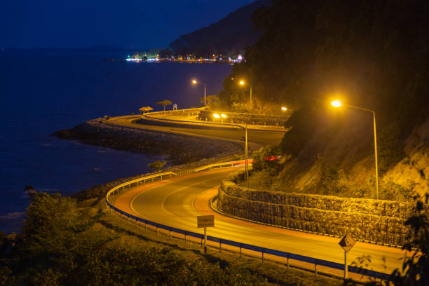 istock curved road by the sea. 825034642