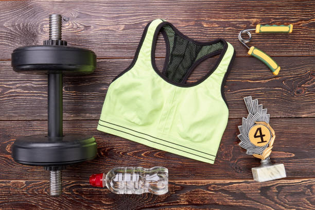 istock Sport equipment, prize, wooden background. 825037530