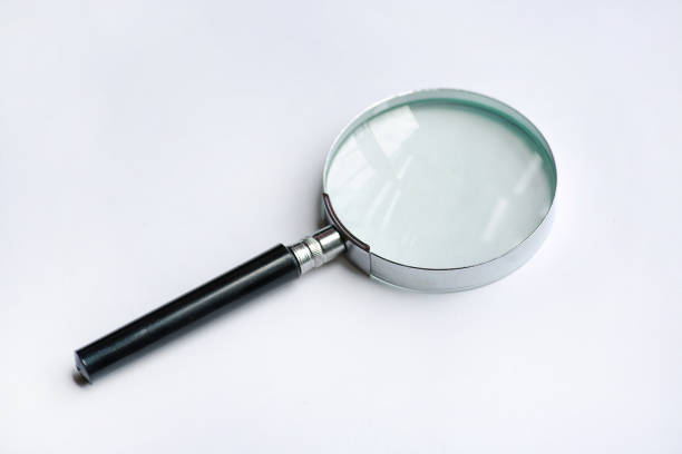 istock Magnifying glass isolated on white background. 825045172